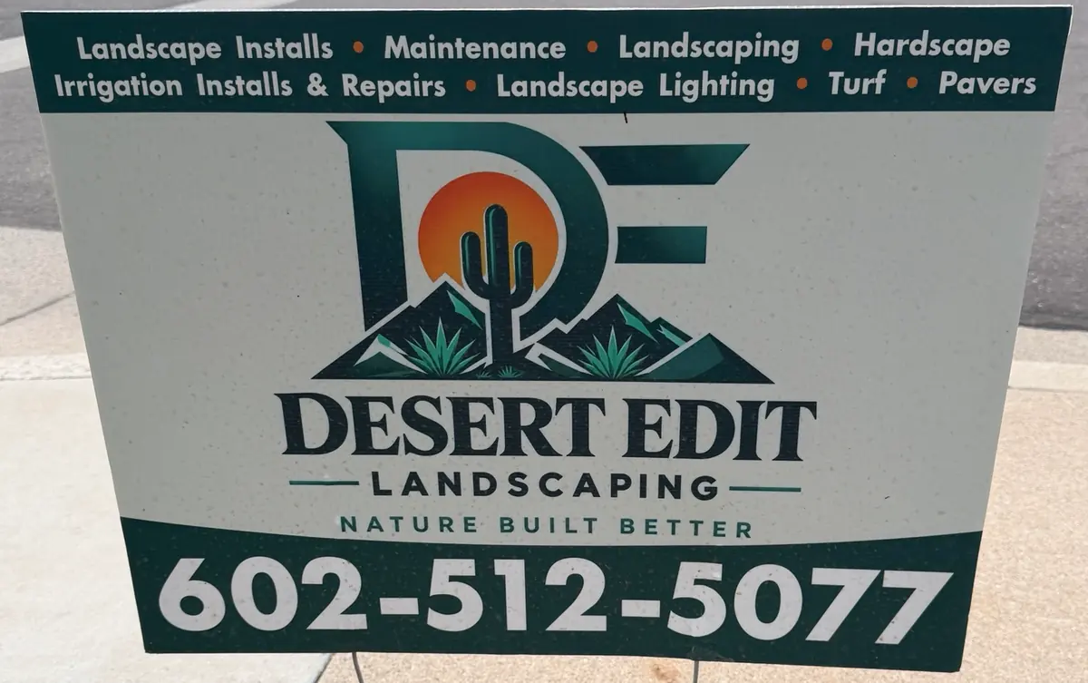 A Desert Edit Landscaping yard sign in a front yard, with the service list across the top and the phone number 602-512-5077 across the bottom